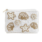 White clutch bag with gold and pearl shell designs on a white background