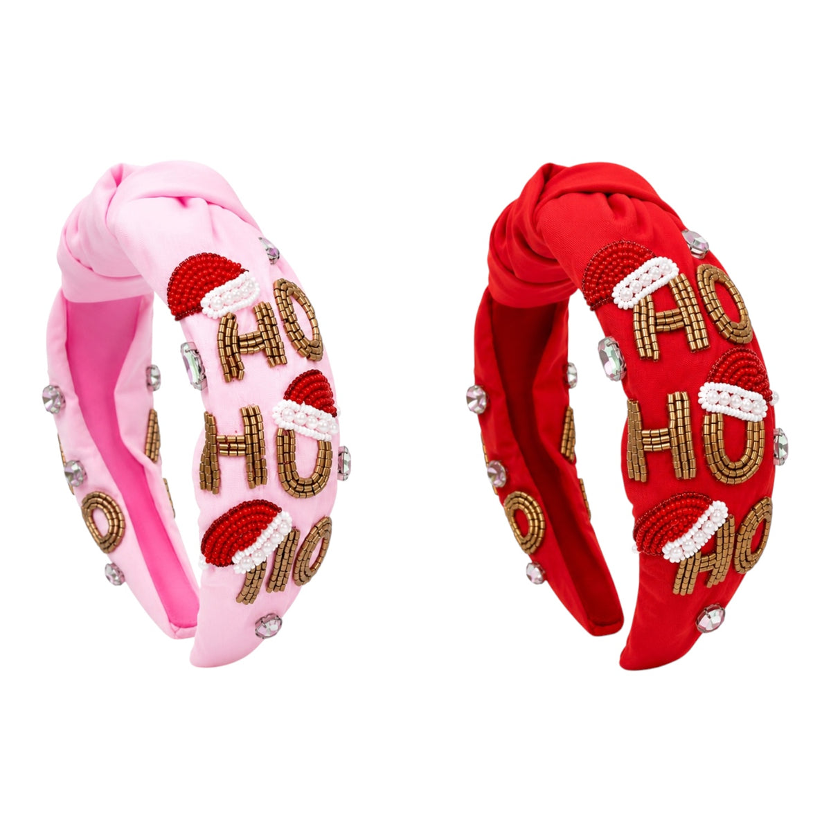 Two knotted fabric headbands on a plain white background, one light pink with red and gold 'HO HO HO' and silver rhinestone embellishments, and one red with matching gold and white 'HO HO HO' lettering and silver rhinestones.