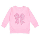 Pink sweatshirt with a large bow design on a white background