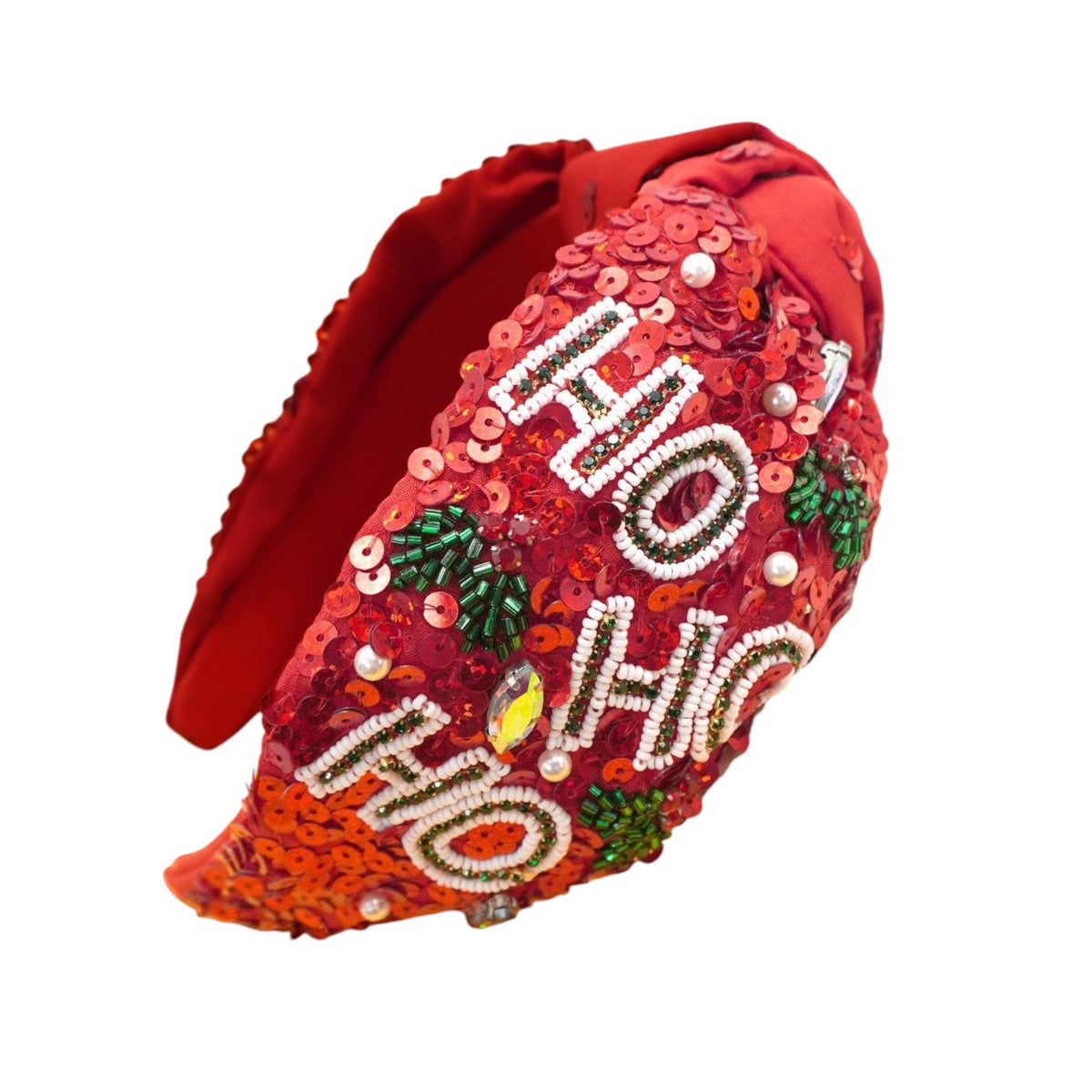 A festive red sequin headband featuring 'HO HO HO' lettering embellished with white rhinestones and green holly leaves, shown on a plain white background.