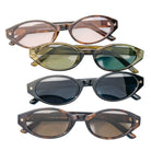 Four pairs of sunglasses with different colored lenses on a white background