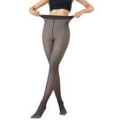 A model wearing sheer black tights, holding the waistband to show elasticity, against a plain white background.