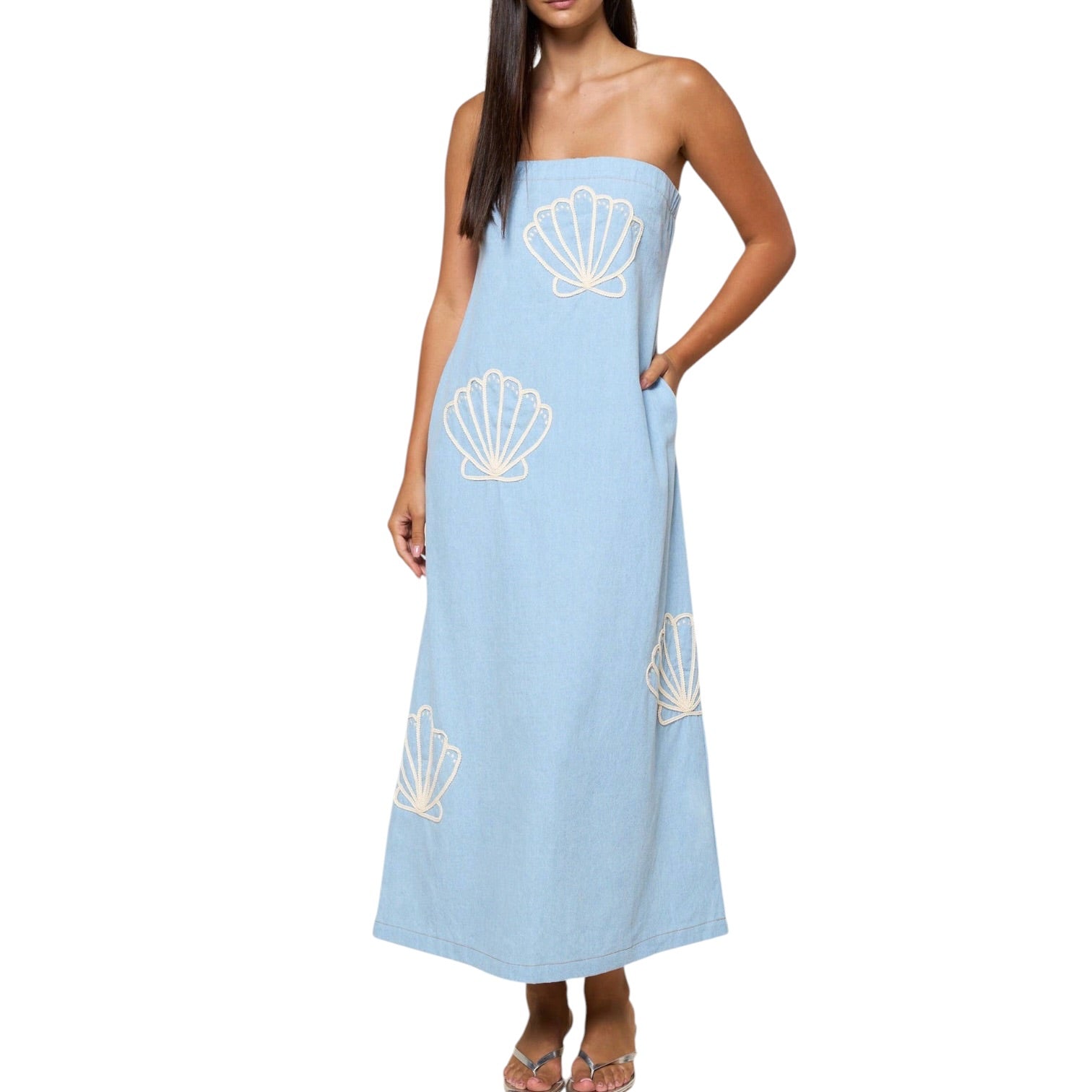 Light blue strapless dress with shell patterns on a white background