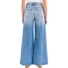 Wide-leg jeans worn by a person on a white background
