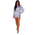 Woman wearing a floral embroidered set on a white background