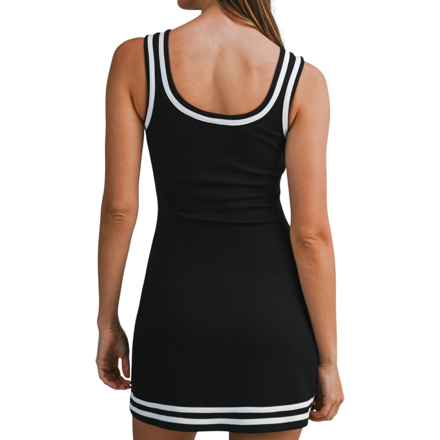 woman wearing black scuba dress with white trim on white background
