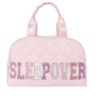 A light pink quilted duffle bag with the word 'SLEEPOVER' spelled out in glittery letters across the front. The bag has two top handles and is shown against a plain white background.