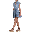 Woman wearing a blue dress on a white background