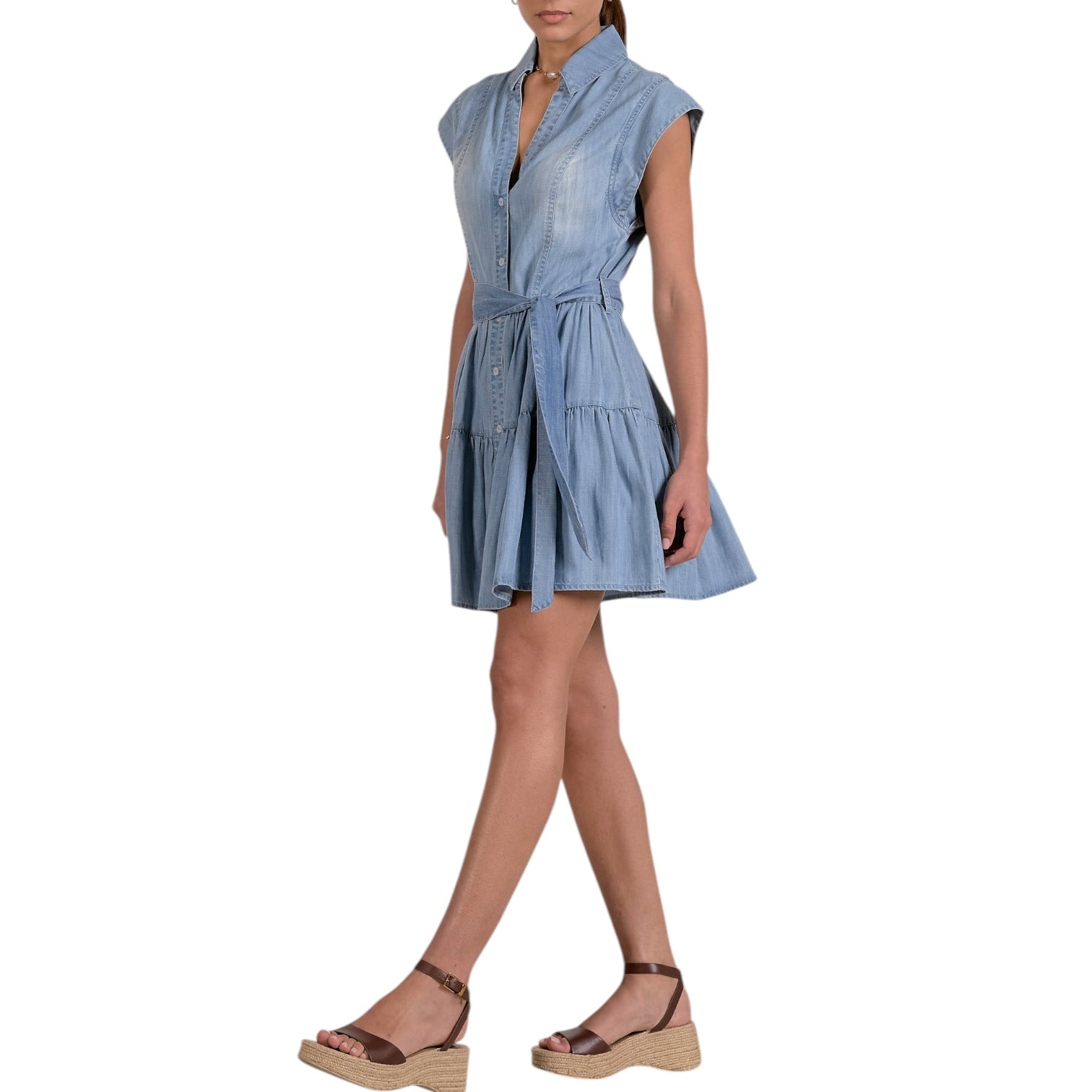 Woman wearing a blue dress on a white background