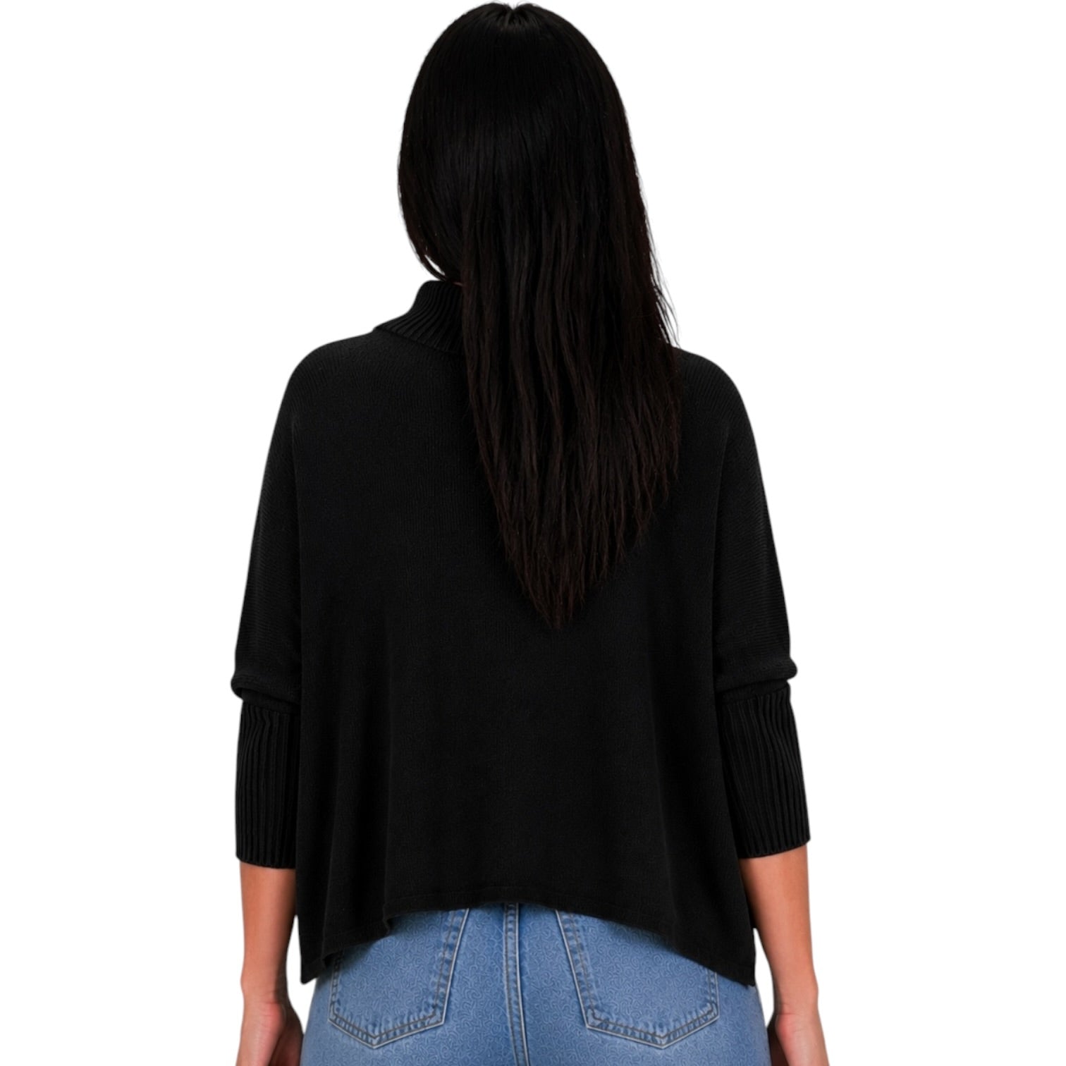A woman viewed from the back wearing a black three-quarter sleeve knit top with ribbed cuffs and light blue jeans, set against a plain white background.