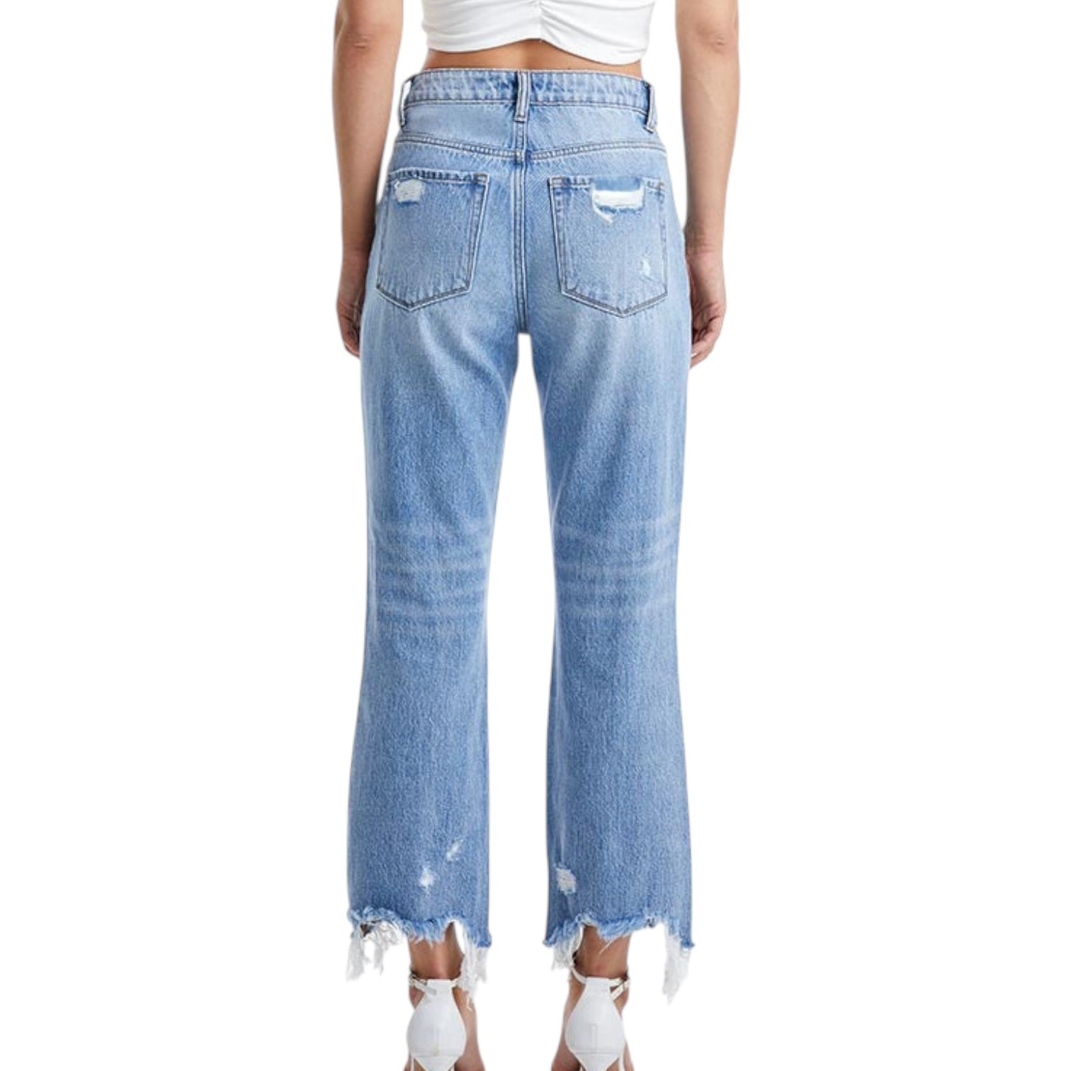 Light blue jeans with distressed details on a white background
