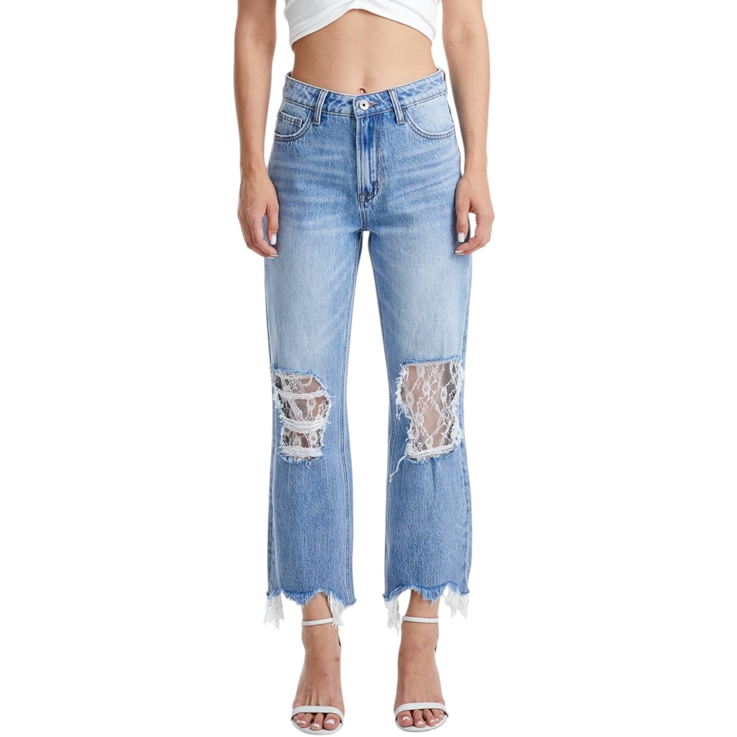 Light blue jeans with lace patches worn by a person on a white background