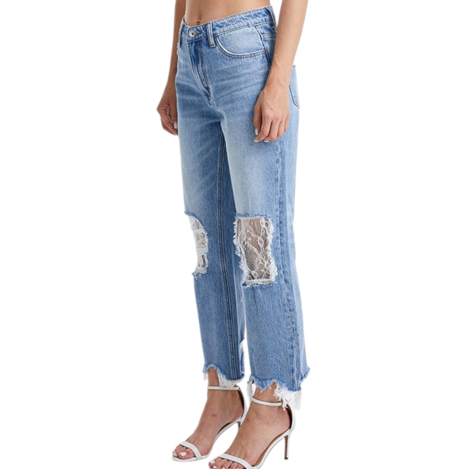 Light blue jeans with lace patches on a white background