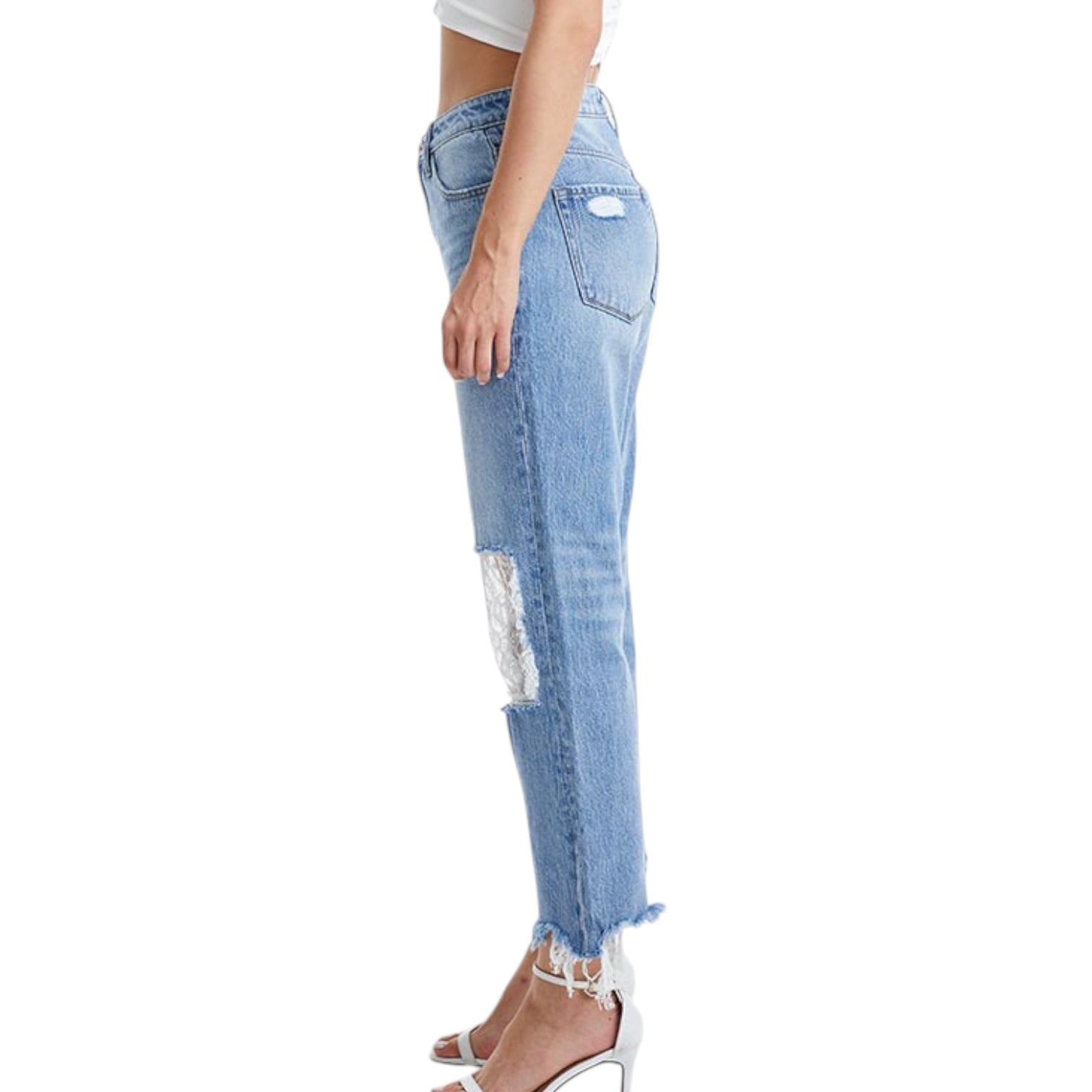 Light blue jeans with lace details on a white background