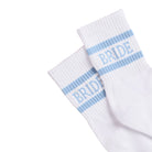 White socks with blue stripes and 'BRIDE' text on a white background