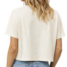 Person wearing a plain white t-shirt on a white background