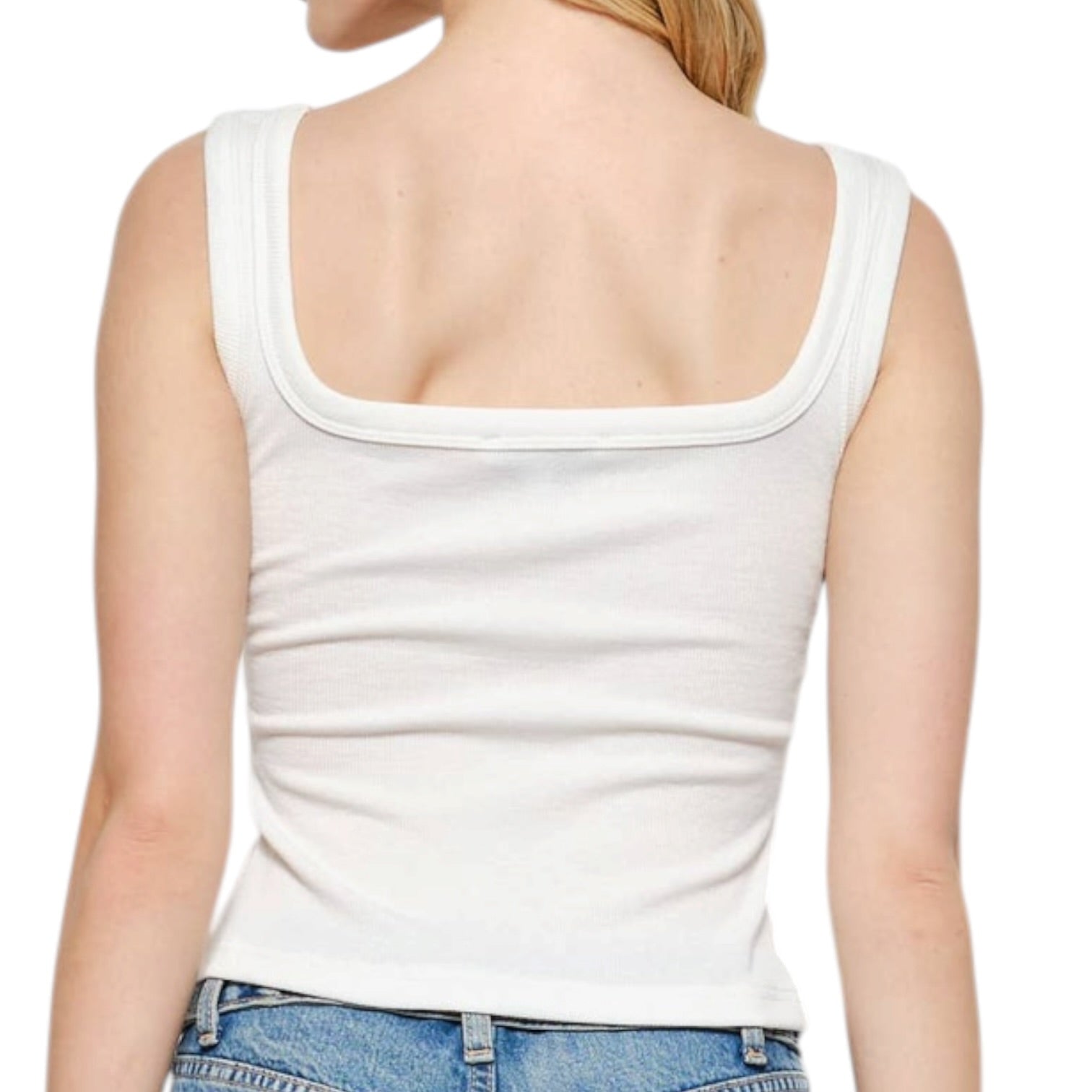Person wearing a white tank top and blue jeans on a white background