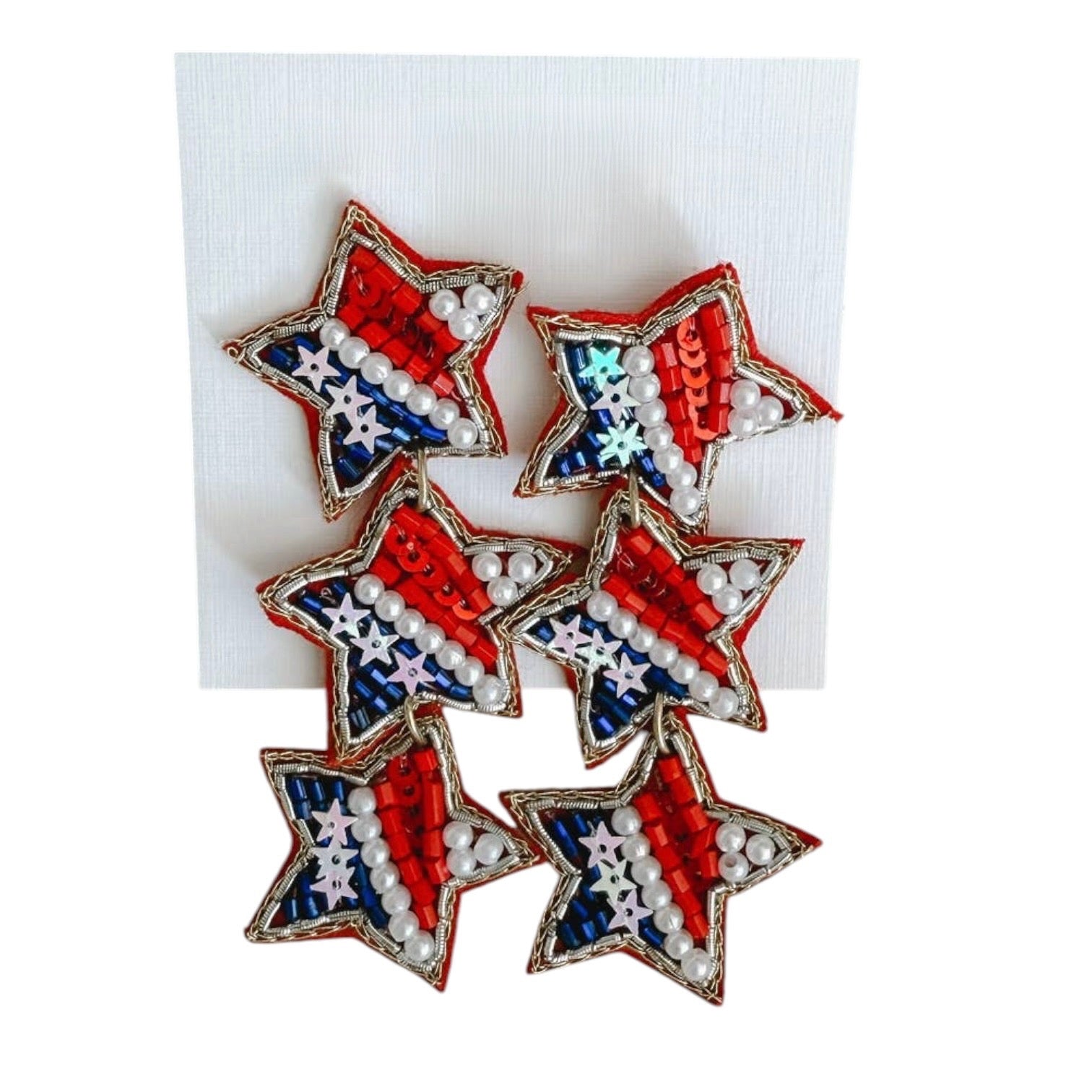 Star-shaped earrings with red, white, and blue design on a white background