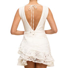 White lace dress with open back on a white background
