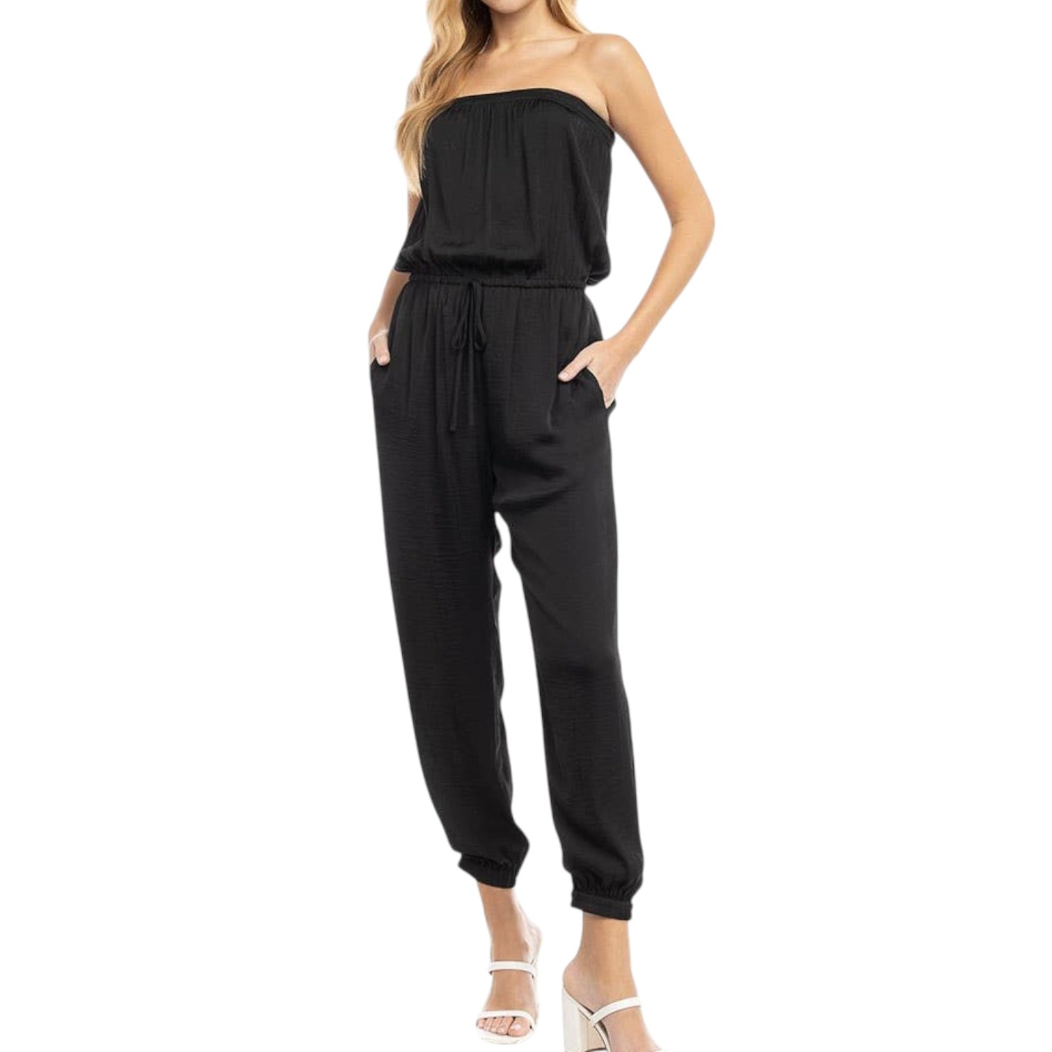Black strapless jumpsuit worn by a model on a white background