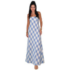 Woman wearing a blue and white checkered dress on a white background