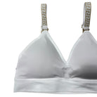 White bra with decorative straps on a white background