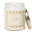 Candle in a jar labeled 'Sugar Cookies' by Sweet Water Decor on a white background