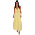 Woman wearing a yellow dress on a white background