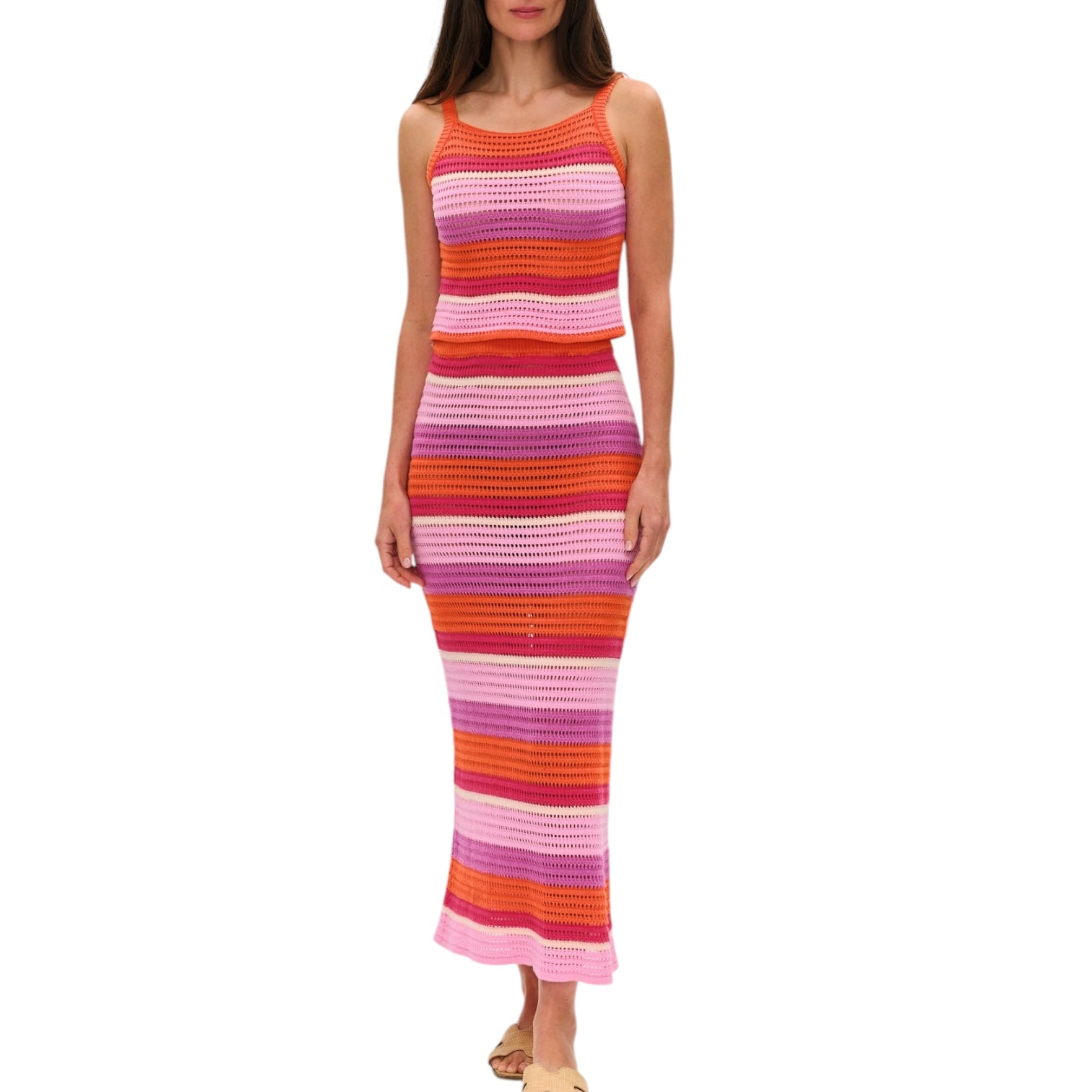 Woman wearing a colorful striped set on a white background