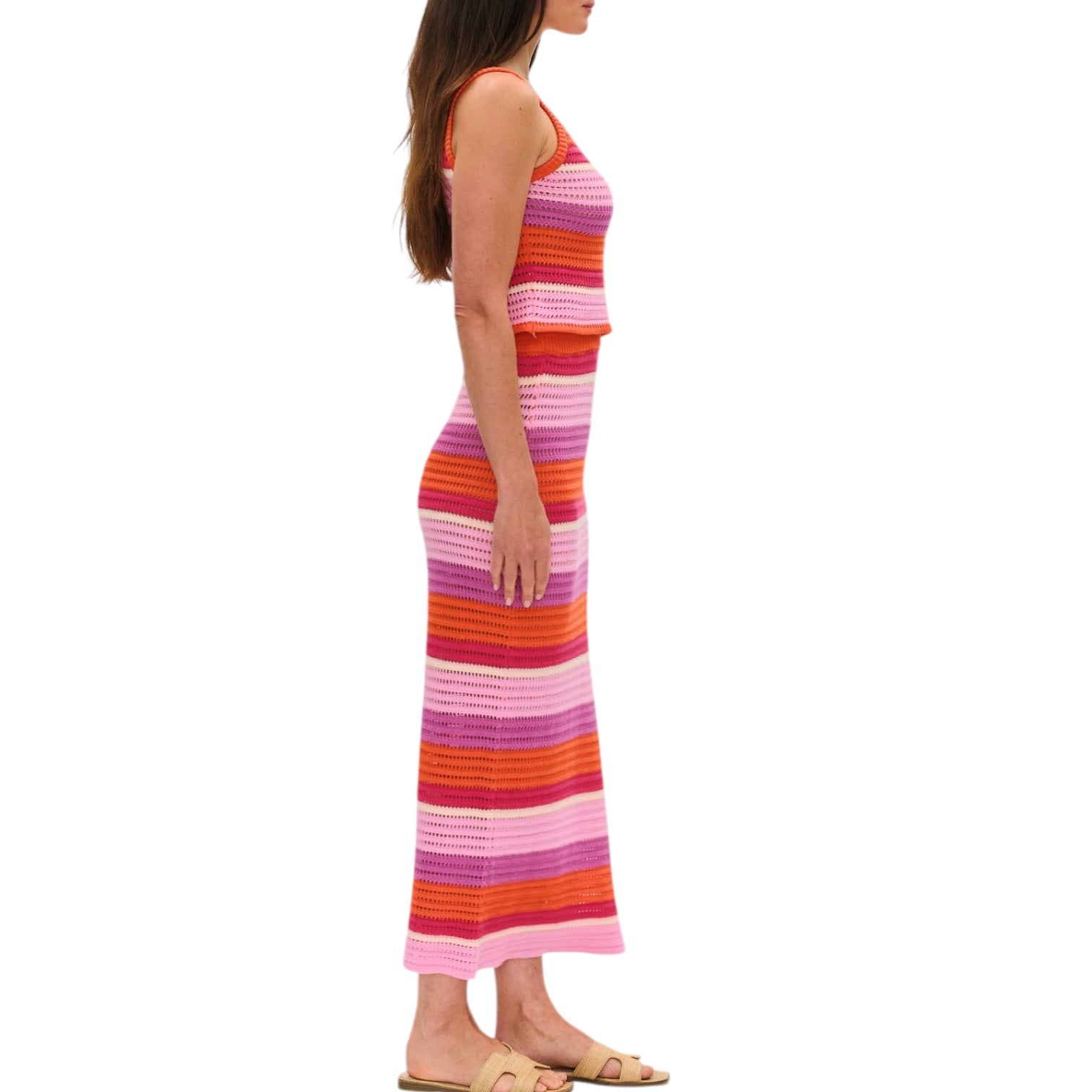 Woman wearing a colorful striped set on a white background