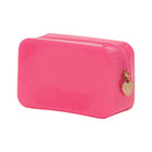 Pink glittery pouch with a gold heart-shaped tag on a white background