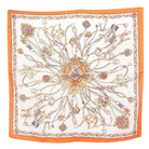 Decorative scarf with intricate patterns and orange border on a white background