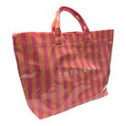 Striped tote bag with pink and orange vertical stripes on a white background