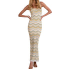 Woman wearing a yellow and white striped dress on a white background