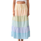 Multicolored striped skirt worn by a person on a white background