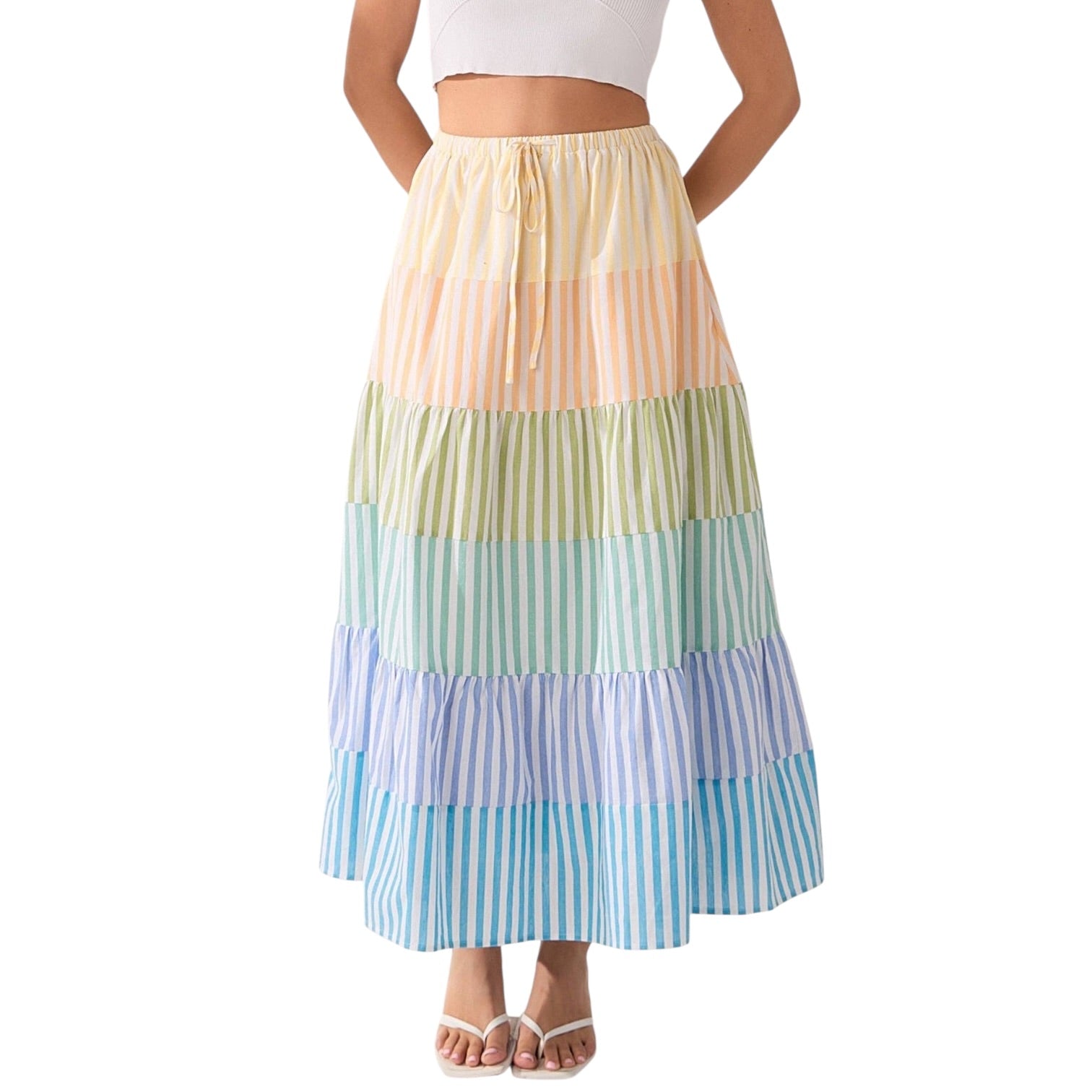 Multicolored striped skirt worn by a person on a white background