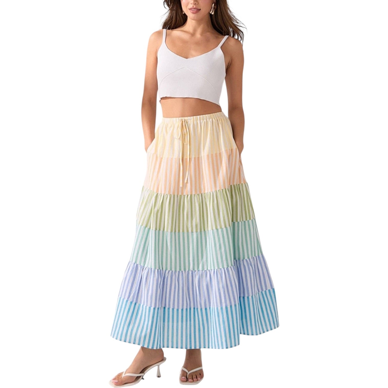 Woman wearing a colorful striped skirt on a white background