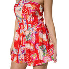 Colorful strapless romper with a pattern on a white background