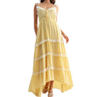 Yellow dress with lace details on a white background