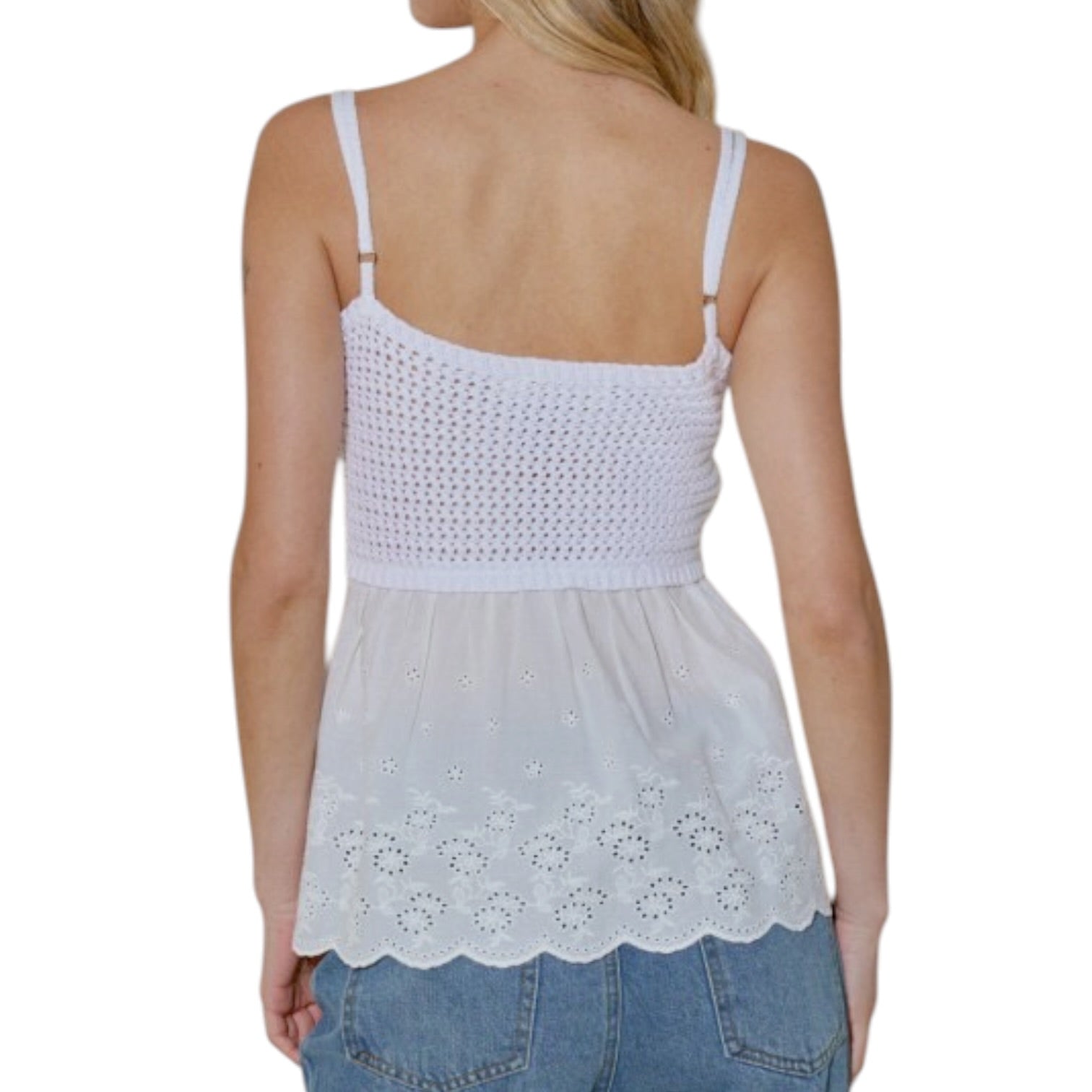 White crochet top worn by a person on a white background