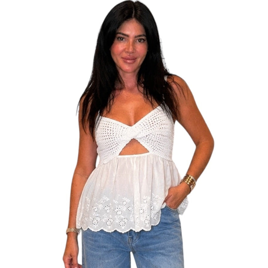 Woman wearing a white top and blue jeans on a white background