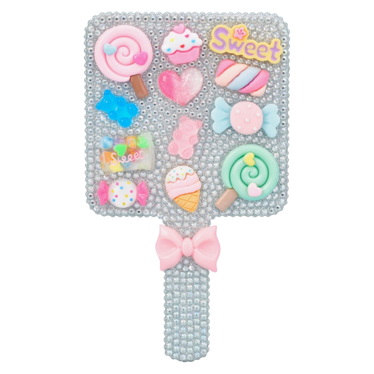 A square handheld mirror covered in rhinestones and decorated with colorful candy-themed embellishments, including lollipops, hearts, cupcakes, a bow, and the word 'Sweet' in yellow. The handle is also rhinestone-covered and finished with a pink bow.