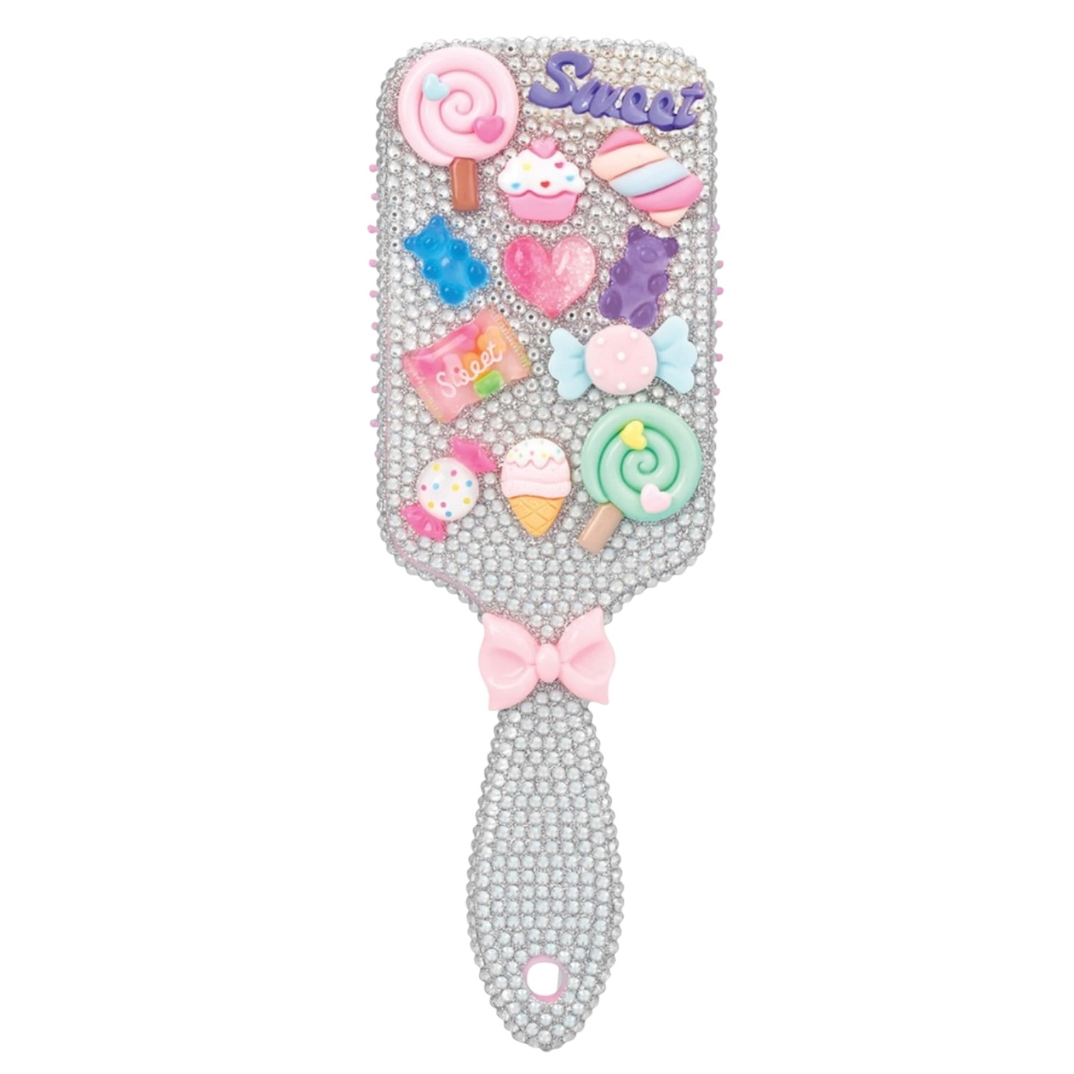 A rhinestone-covered hair mirror with a pink bow on the handle and an array of colorful 3D candy and dessert charms on the reflective surface, including lollipops, gummy bears, a pink heart, and a pink script word that appears to read 'Sweet'.