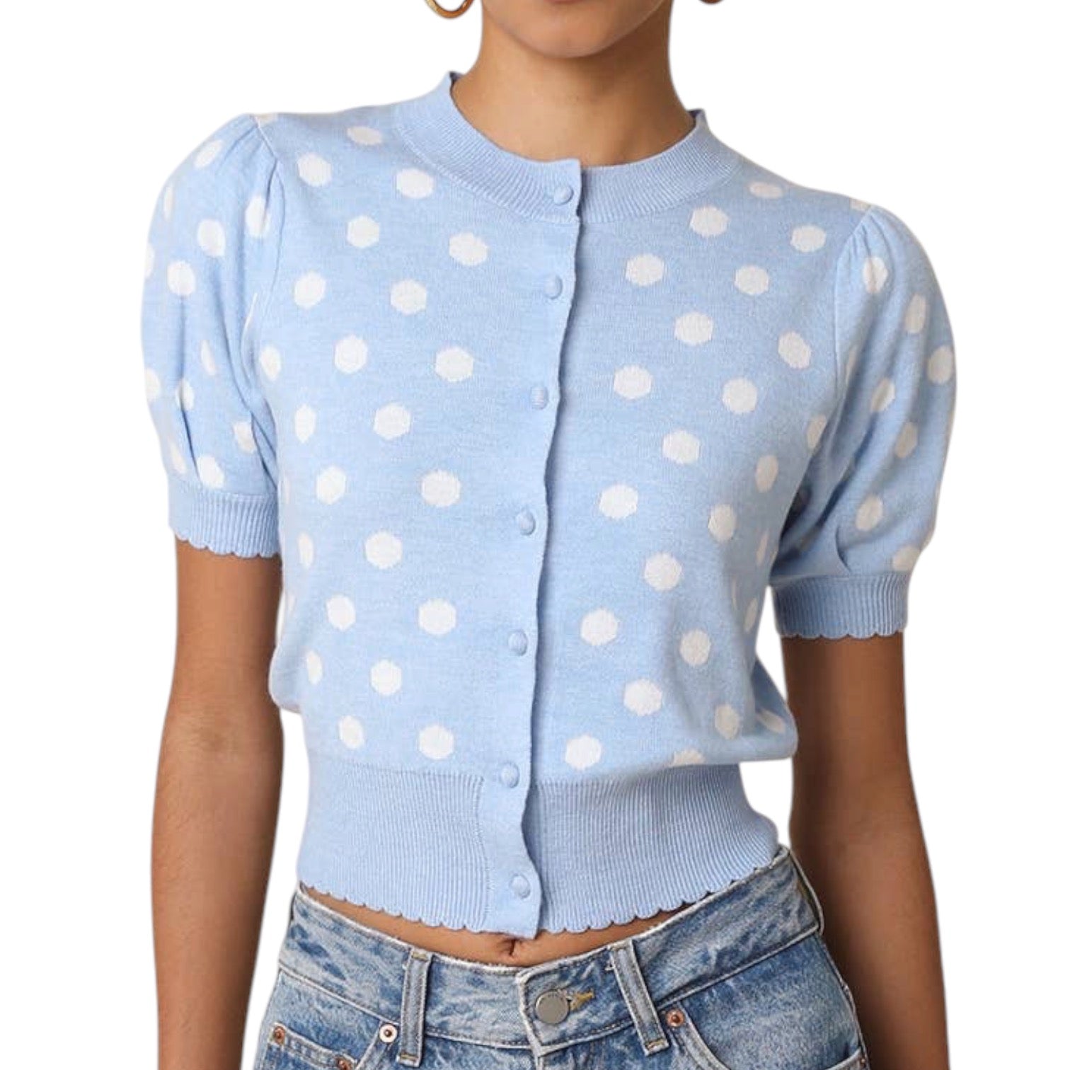 a woman wearing a blue and white polka dot short sleeve puff sleeve cardigan on white background
