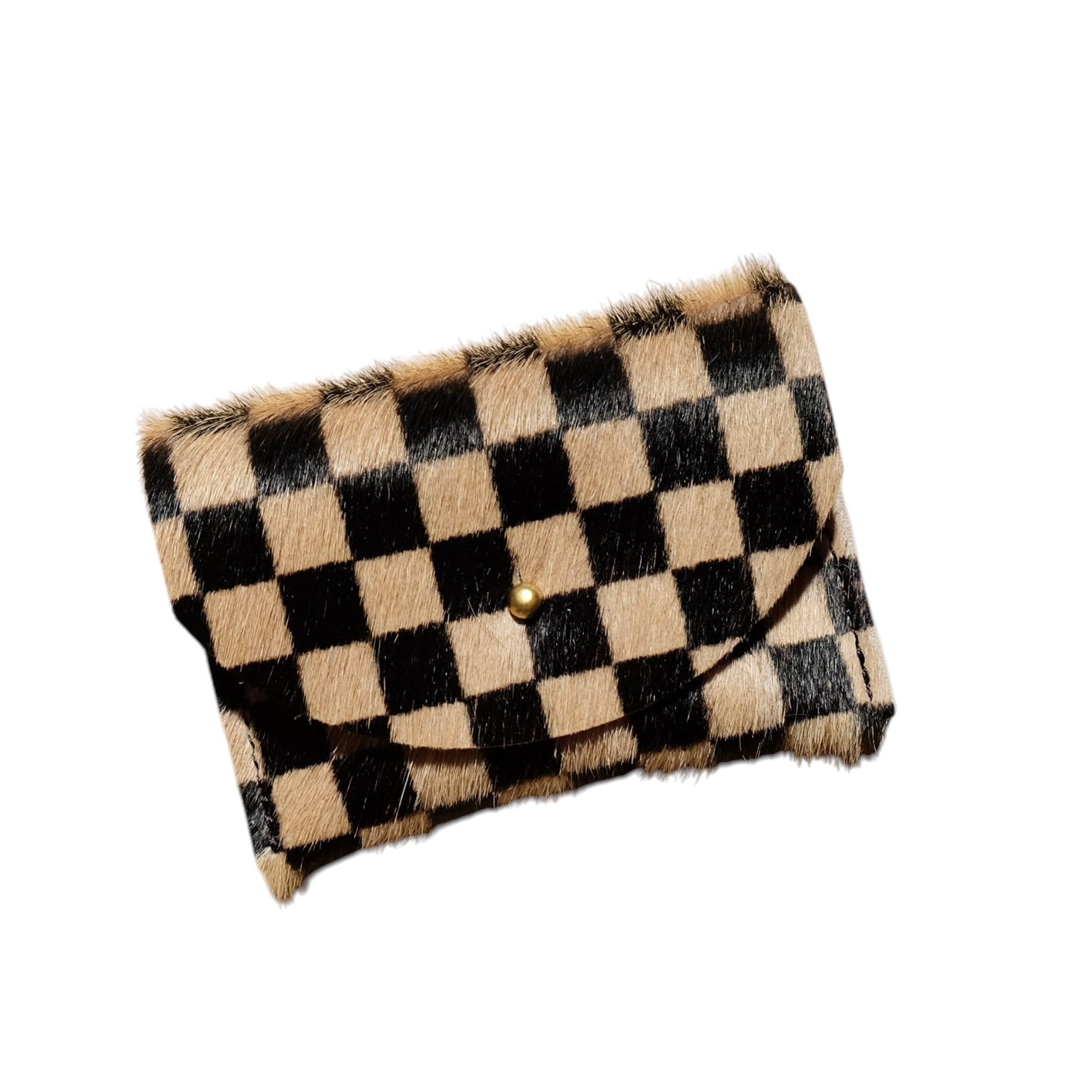 A cowhide cardholder with a black and tan checkerboard pattern and a small gold snap button, shown on a plain white background.