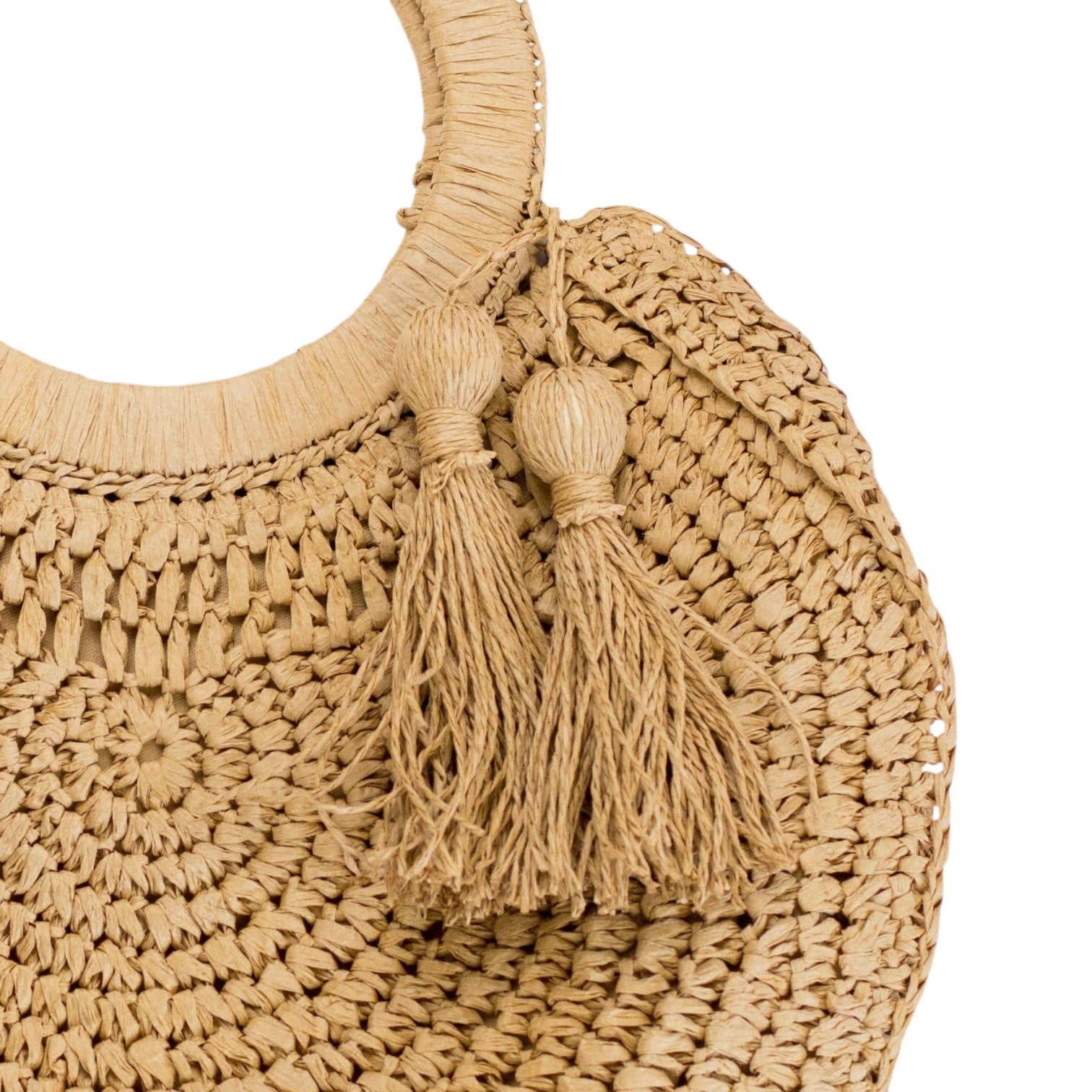 Beige woven handbag with tassels on a white background