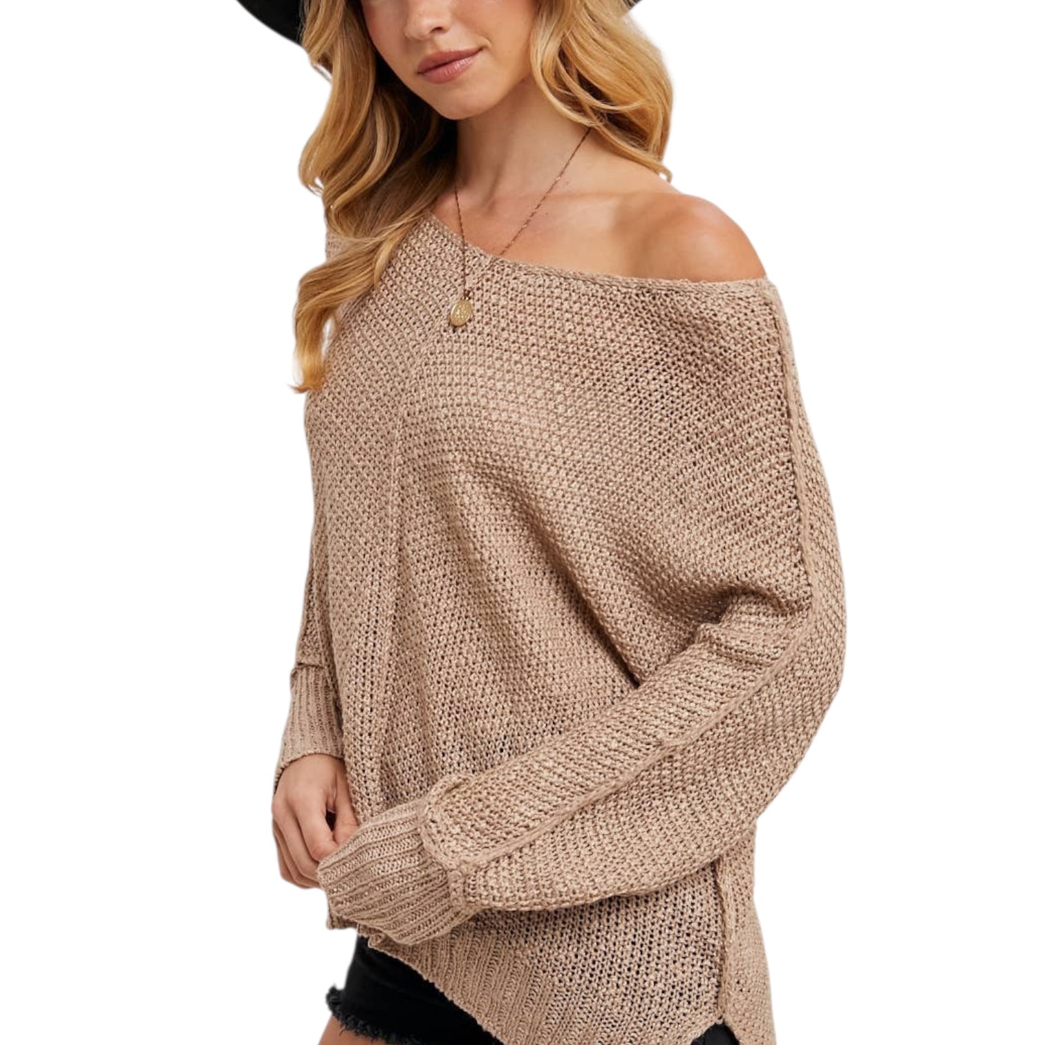 Woman wearing a beige off-shoulder sweater on a white background