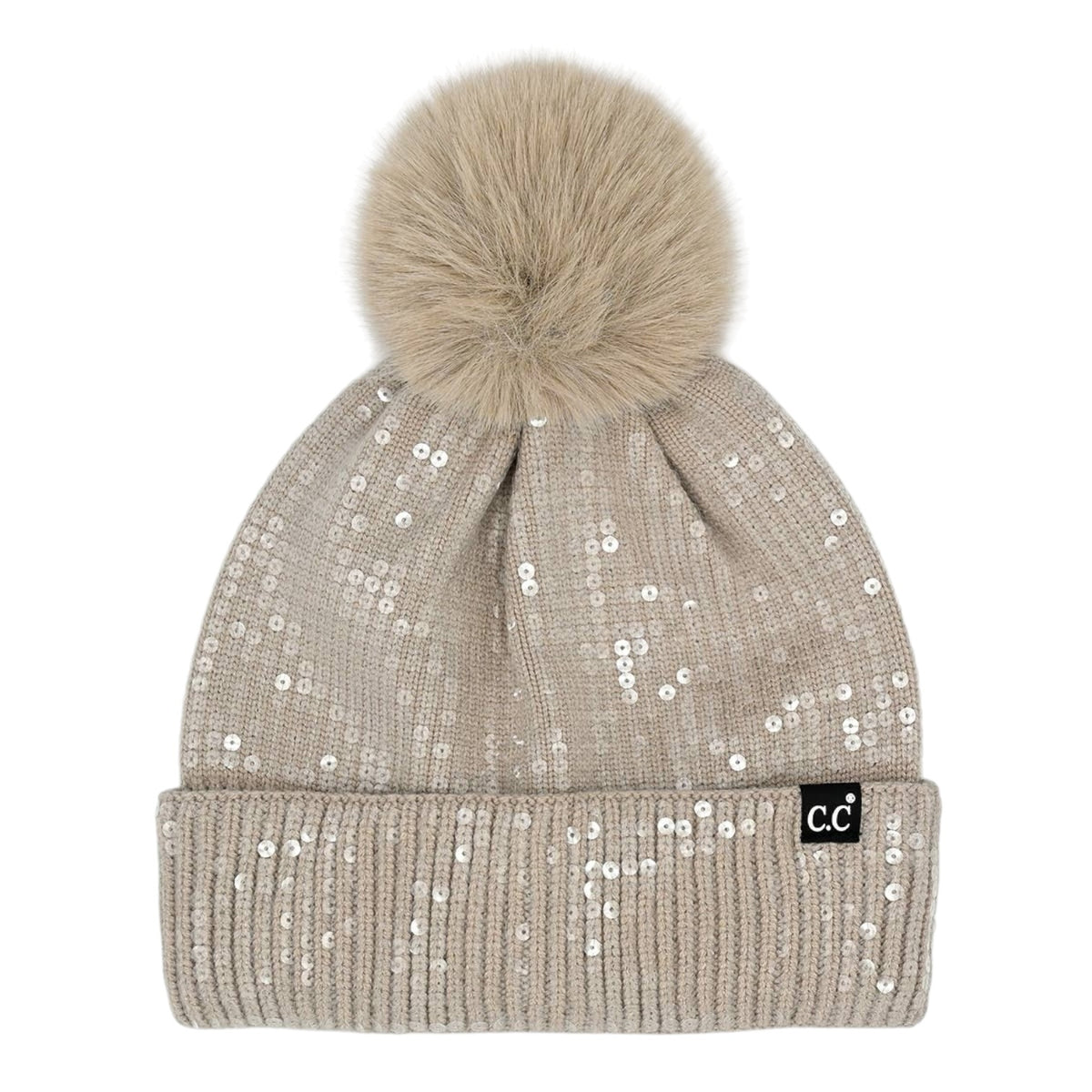 A beige knit pom-pom beanie covered in small silver sequins, featuring a fluffy beige faux-fur pom-pom and a small black 'cc' logo patch on the folded cuff.