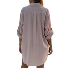 Striped shirt dress worn by a person on a white background