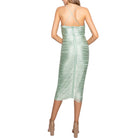 Green dress with crinkled texture on a white background